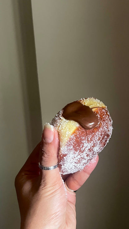 dark chocolate custard bomboloni doughnut